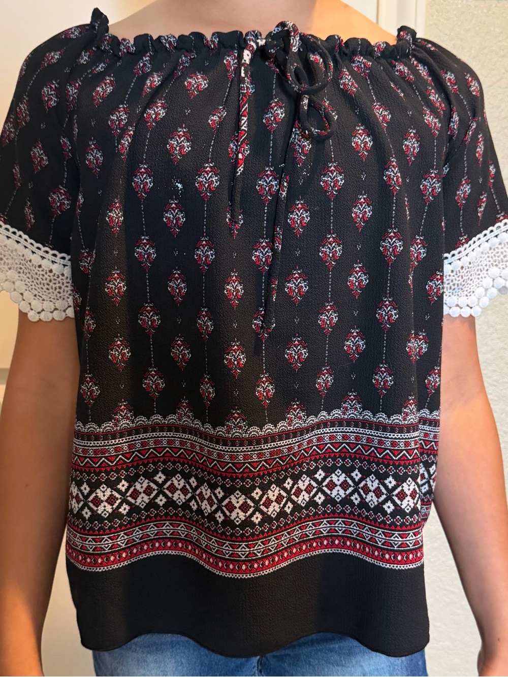 Girls Black Off-Shoulder Top with Red Floral Print and Crochet Trim